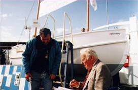 Harding McGregor Dunnett and Trevor Potts with the Sir Ernest Shackleton, the replica of the James Caird, in which Potts and three others retraced Shackleton's perilous boat journey.